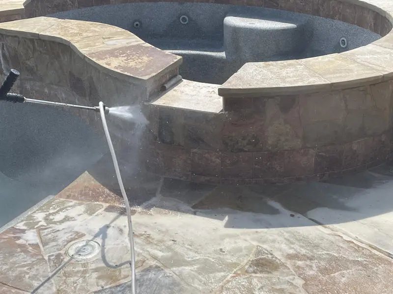 pool cleaning power blasting pool wall