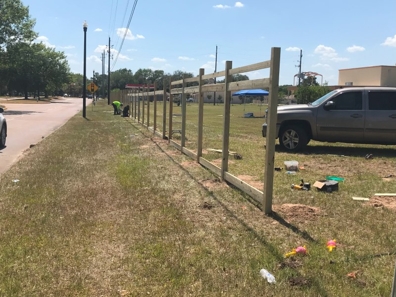 installing fence post Montgomery fence & deck company